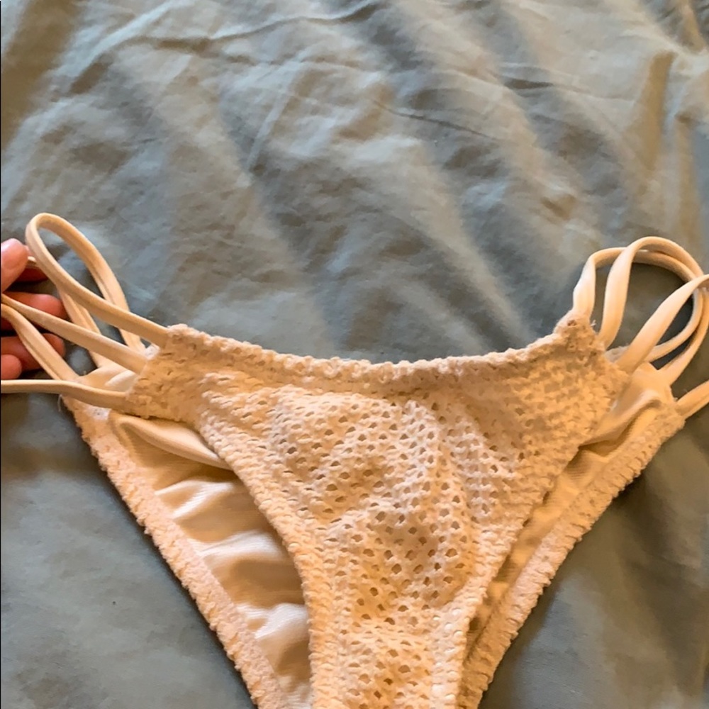 Cream bottoms with straps on sides